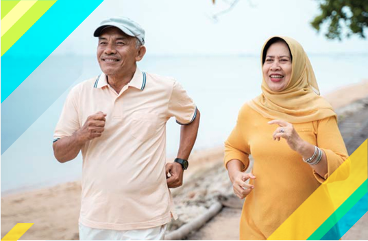 smiling couple running along the beach